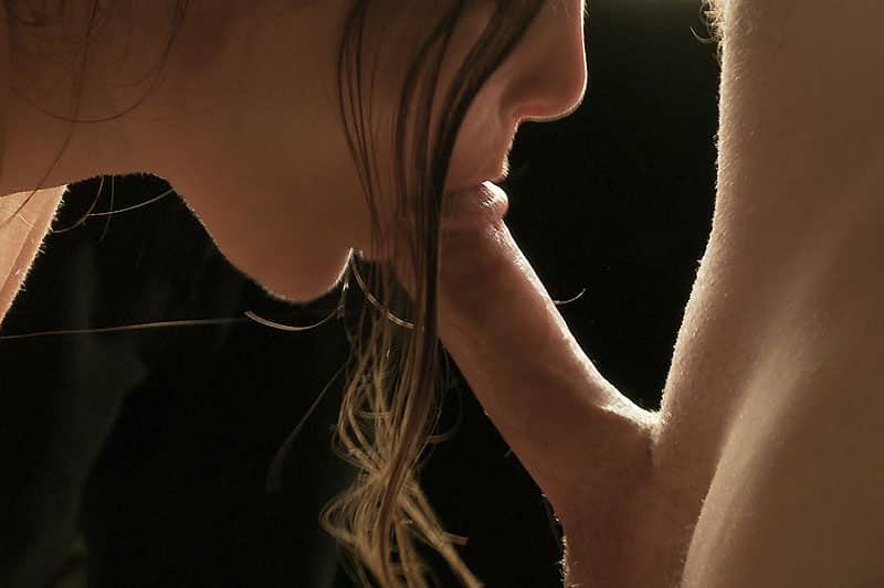 Erotic photo galleries - Couple engages in a beauitful backlit blowjob, fellatio
